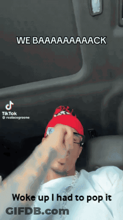 Man In Red Hat And White Shirt In Car Saying We Baaaack GIF