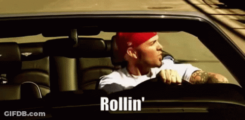 Man In Red Hat Driving Car With Rollin GIF
