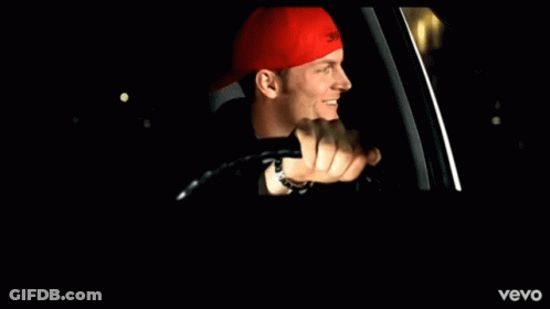 Man In Red Hat Driving Vevo Car GIF