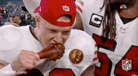 Man In Red Hat Eating Chicken Wing GIF
