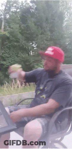 Man In Red Hat Holding Bottle GIF