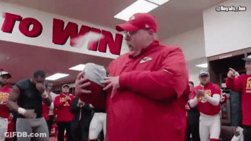 Man In Red Hat Holding Football Saying To Win GIF
