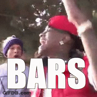 Man In Red Hat Holding Stick With Bars GIF