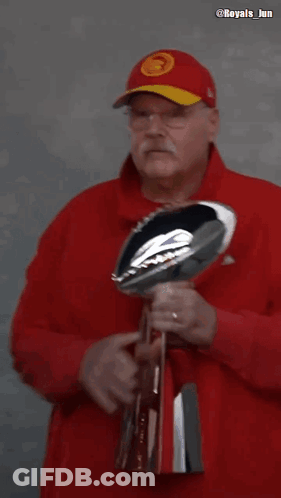 Man In Red Hat Kissing NFL Trophy GIF