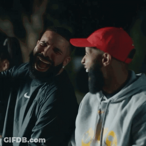 Man In Red Hat Laughing Next To Another Man GIF