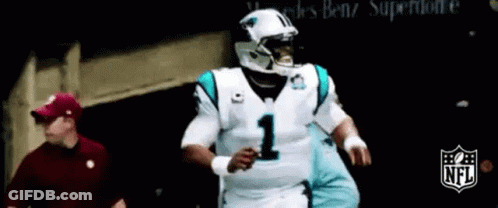 Man In Red Hat Next To Football Player In White Jersey Number 1 GIF