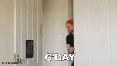 Man In Red Hat Peeking Out Of Door GIF