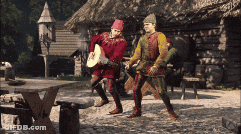Man In Red Hat Playing Guitar With Another Man Behind GIF