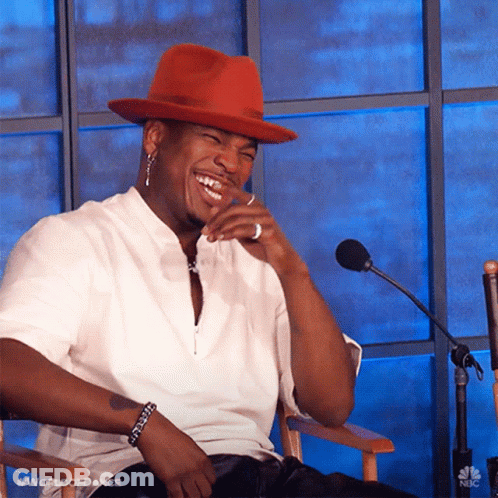 Man In Red Hat Sitting At Microphone GIF