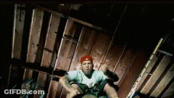 Man In Red Hat Sitting On Wooden Floor GIF