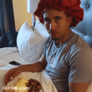 Man In Red Hat Sitting With Food GIF