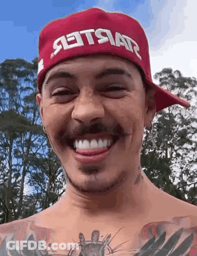 Man In Red Hat Smiling With Tongue Out GIF