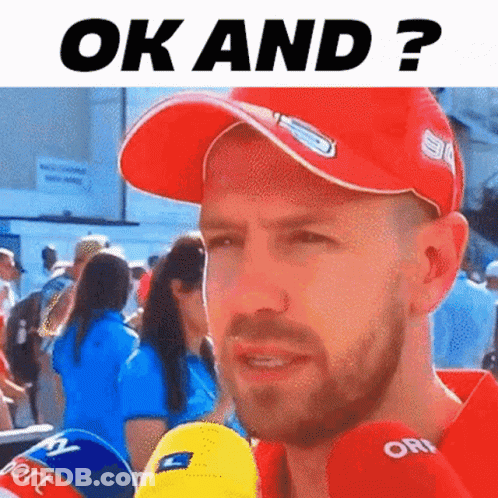 Man In Red Hat Talking Into Microphone GIF