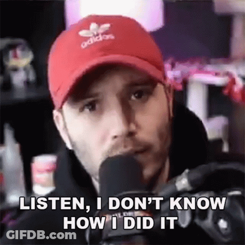 Man In Red Hat Talking Into Microphone Saying Listen I Don't Know How I Did GIF