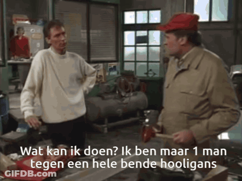 Man In Red Hat Talking To Another Man In Garage GIF