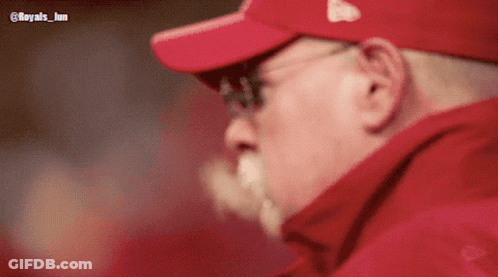 Man In Red Hat With Letter E Looking Down GIF