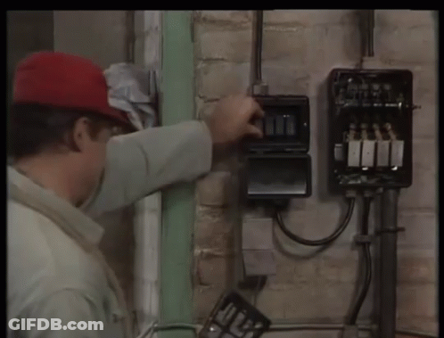 Man In Red Hat Working On Electrical Box GIF