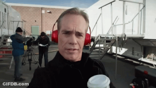 Man In Red Headphones Holding Coffee Cup GIF