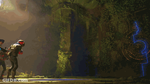 Man In Red Helmet Standing In Front Of Glowing Blue Robot GIF