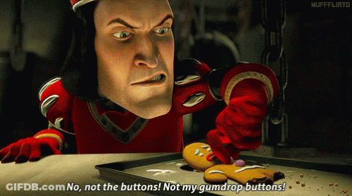 Man In Red Holding Gingerbread Man GIF