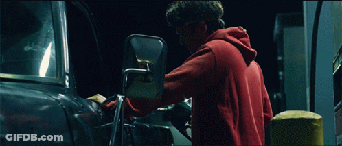 Man In Red Hoodie Adjusting Car Mirror GIF