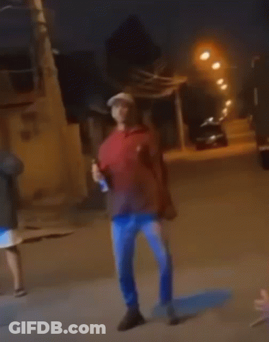 Man In Red Hoodie And Blue Jeans Holding Beer GIF