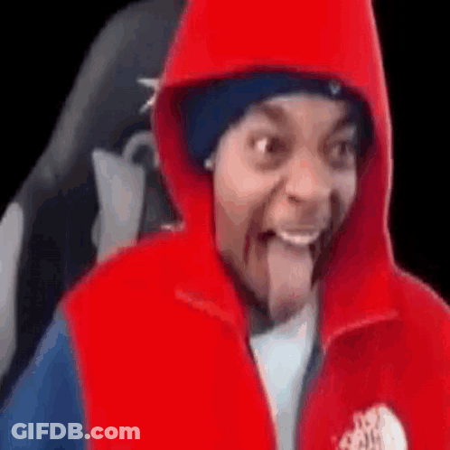 Man In Red Hoodie And Red Vest Sticking Tongue Out GIF