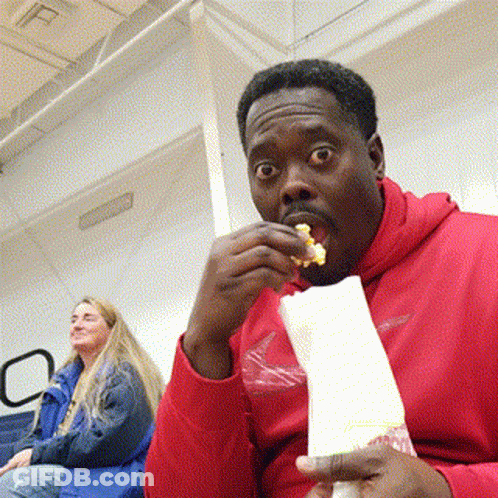 Man In Red Hoodie Eating Popcorn GIF
