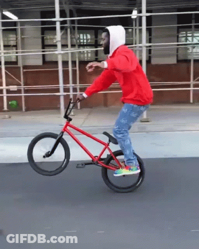 Man In Red Hoodie Riding Red BMX Bike GIF
