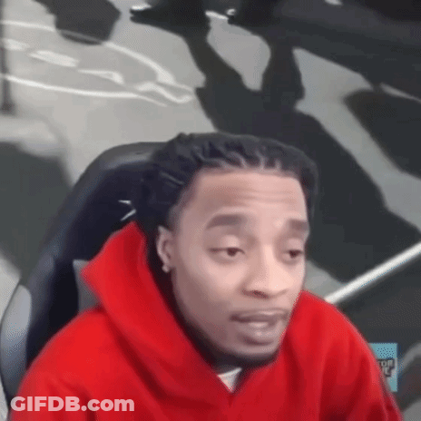 Man In Red Hoodie Sitting With Eyes Closed GIF