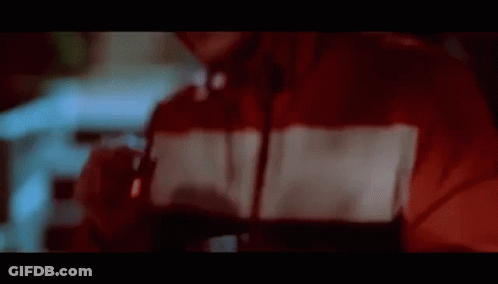 Man In Red Hoodie Smoking At Night GIF