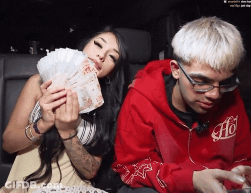 Man In Red Hoodie With Ao Next To Woman Holding Money GIF