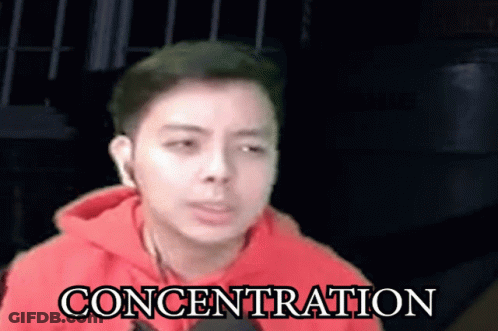 Man In Red Hoodie With Concentration GIF