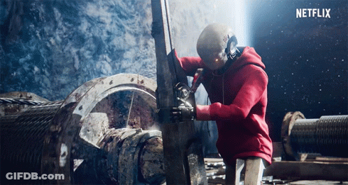Man In Red Hoodie Working On Machine GIF