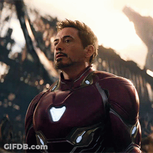 Man In Red Iron Man Suit Before Burning Building GIF