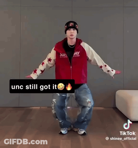 Man In Red Jacket And Beanie Dancing GIF