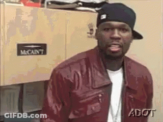 Man In Red Jacket And Black Hat By Cabinet GIF
