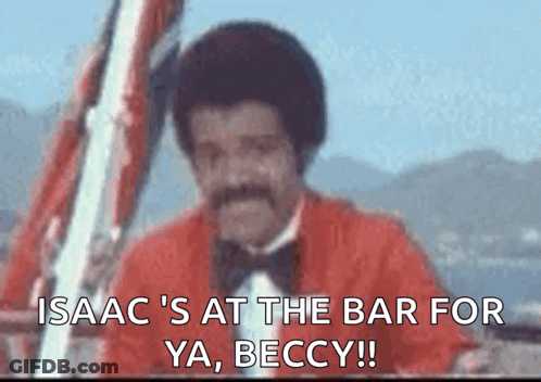 Man In Red Jacket And Bow Tie Says Isaac At Bar GIF