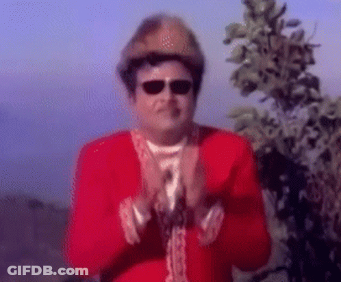 Man In Red Jacket And Hat Clapping Hands GIF