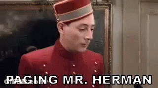 Man In Red Jacket And Hat Saying Paging Mr. Herman GIF