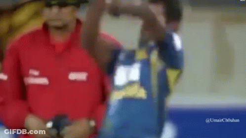 Man In Red Jacket And Man In Blue Shirt GIF