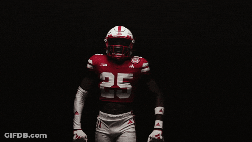 Man In Red Jacket And Red Hat With Huskers GIF