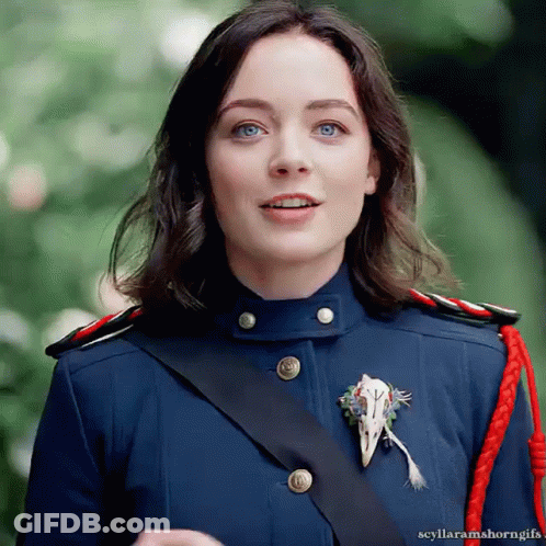 Man In Red Jacket And Tie At Desk GIF