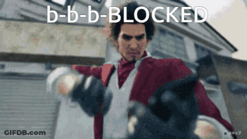 Man In Red Jacket And White Vest Holding Gun In Front Of Building GIF