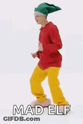 Man In Red Jacket And Yellow Pants Elf Dancing GIF
