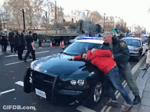 Man In Red Jacket Arrested By Police Officer GIF