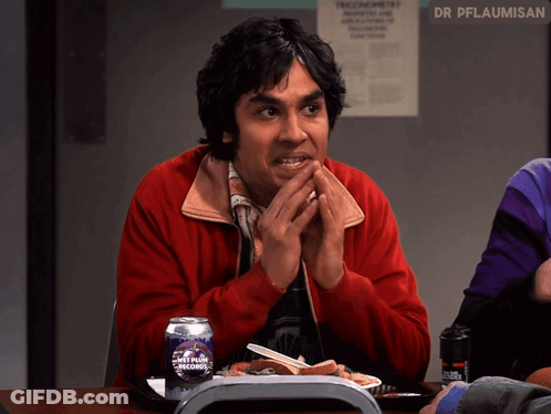 Man In Red Jacket At Table With Ant Plus Records GIF