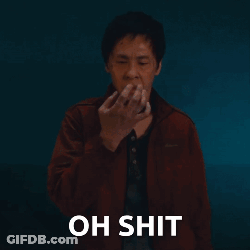 Man In Red Jacket Covering Mouth Saying Oh Shit GIF