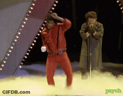 Man In Red Jacket Dancing And Man Singing GIF