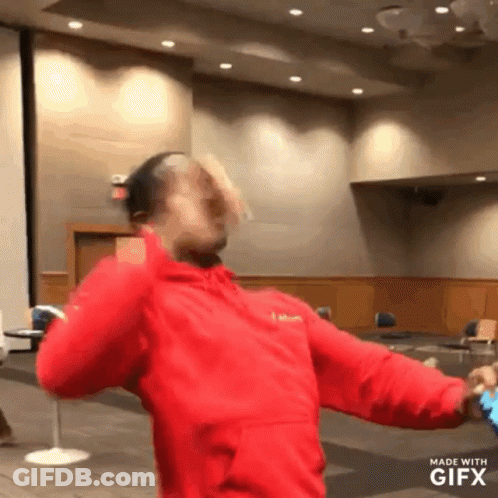 Man In Red Jacket Dancing Gifx Watermark GIF